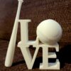 Paintable item with LOVE with a baseball O and a leaning baseball bat